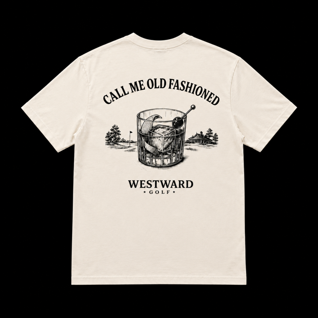 Cream Westward Golf old fashioned graphic t-shirt with cocktail glass artwork, golf course scenery, and CALL ME OLD FASHIONED back print on black studio background