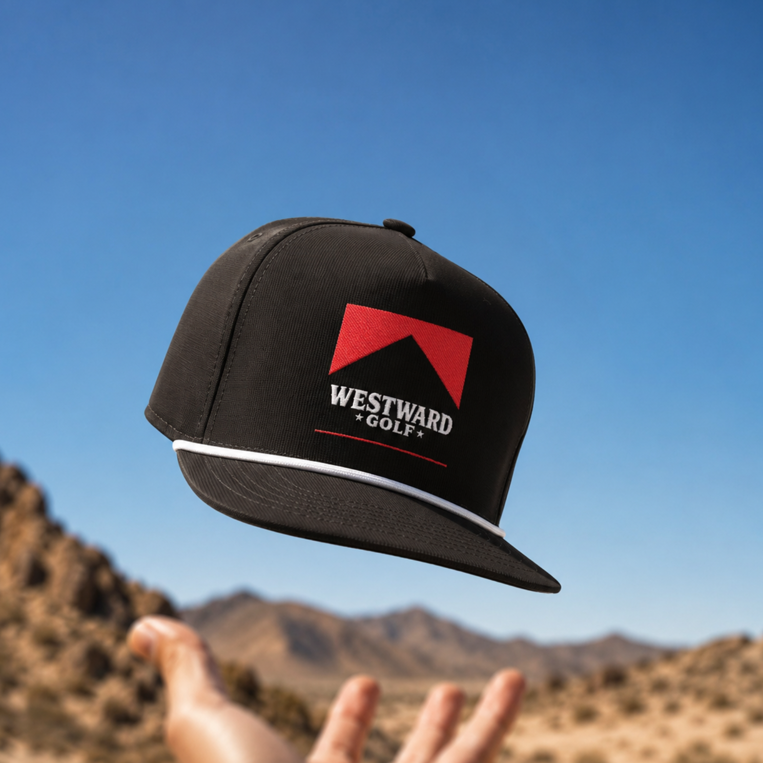 Westward Golf black snapback hat with red logo, western golf cap, men’s rope hat, flat bill golf hat, embroidered golf apparel accessory, premium black golf lifestyle headwear.
