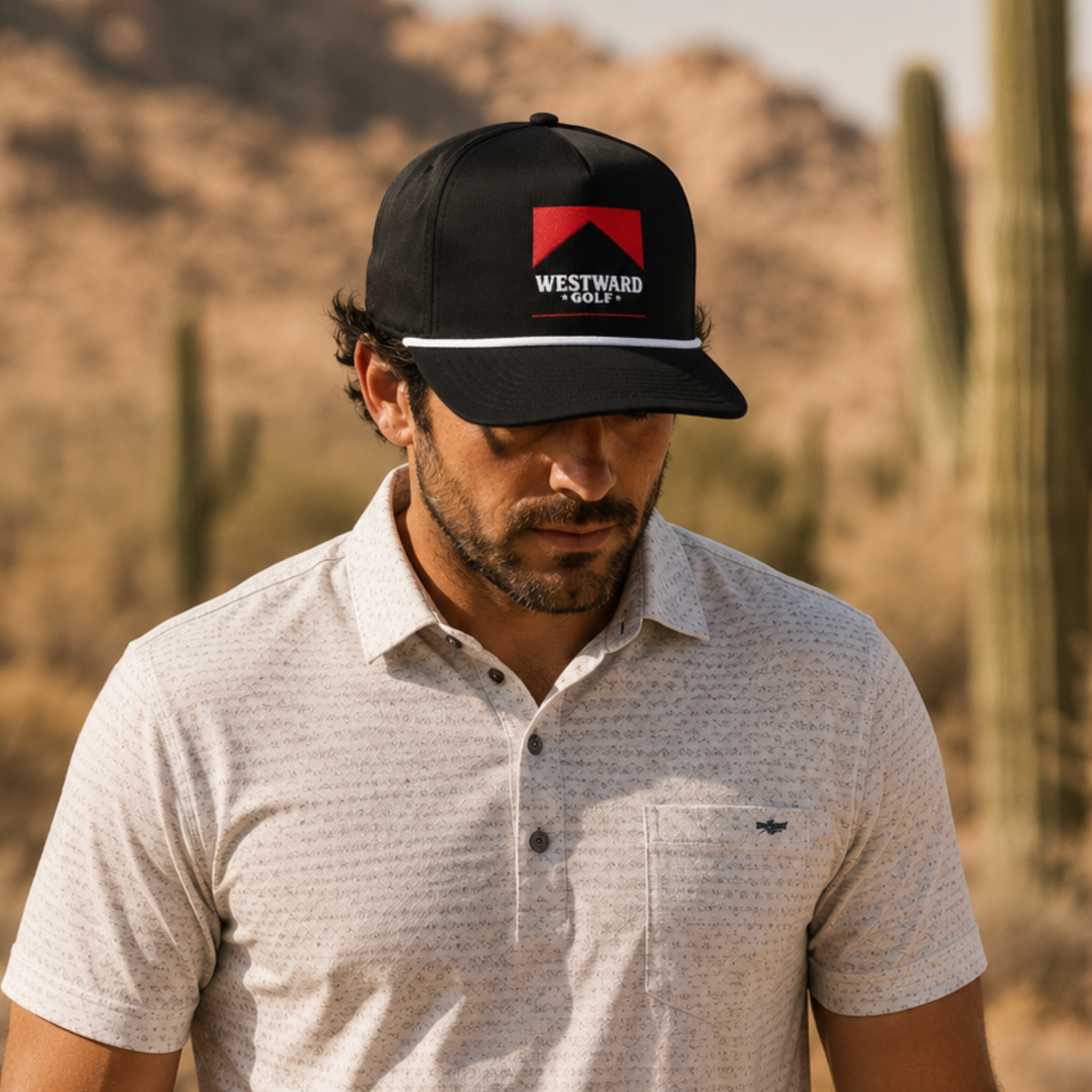 Westward Golf black rope snapback hat, men’s flat bill golf cap, red embroidered golf logo, western golf apparel accessory, premium black golf lifestyle headwear, desert golf style.