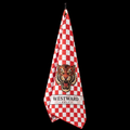 Red and white checkered Westward Golf towel hanging on black background with bold vintage roaring tiger logo, premium checkerboard golf bag towel with gold ring and brass grommet, standout golf towel accessory for cleaning golf clubs, golf balls, grips, hands, and gear on the course.