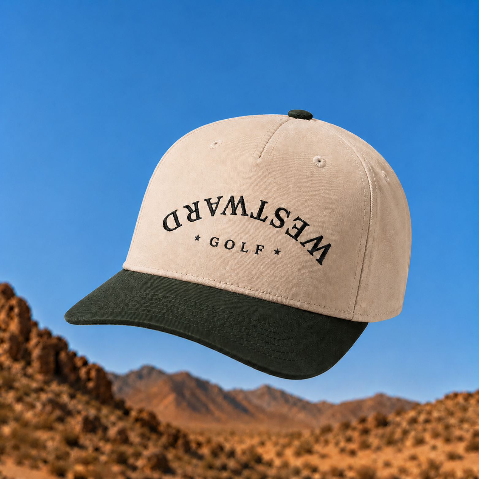 Beige and black cap with 'Westward Golf' text against a desert landscape