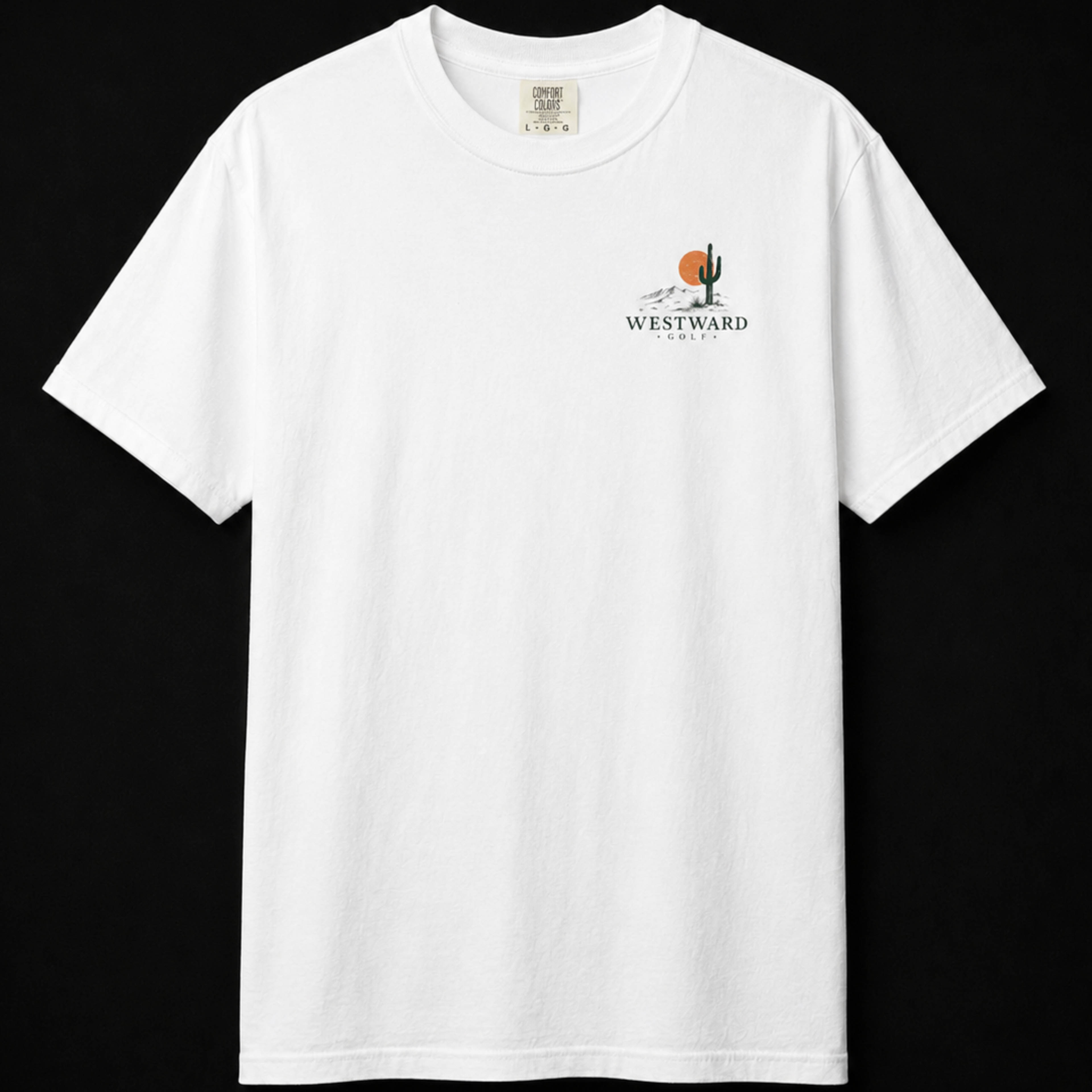 White Westward Golf T-shirt front mockup on black studio background, featuring small chest desert golf logo with cactus, orange sunset, mountains, and minimalist Westward Golf branding.